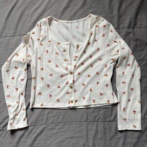 White and red flower button up top.